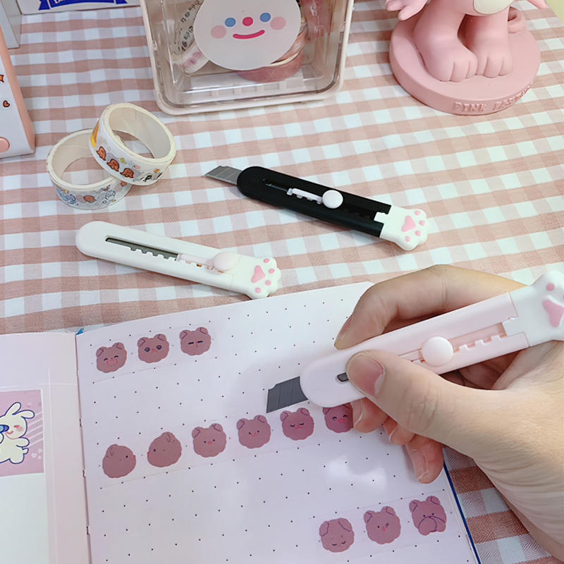 Cute and compact cloud-shaped paper cutter with self-retracting blade, safe and convenient