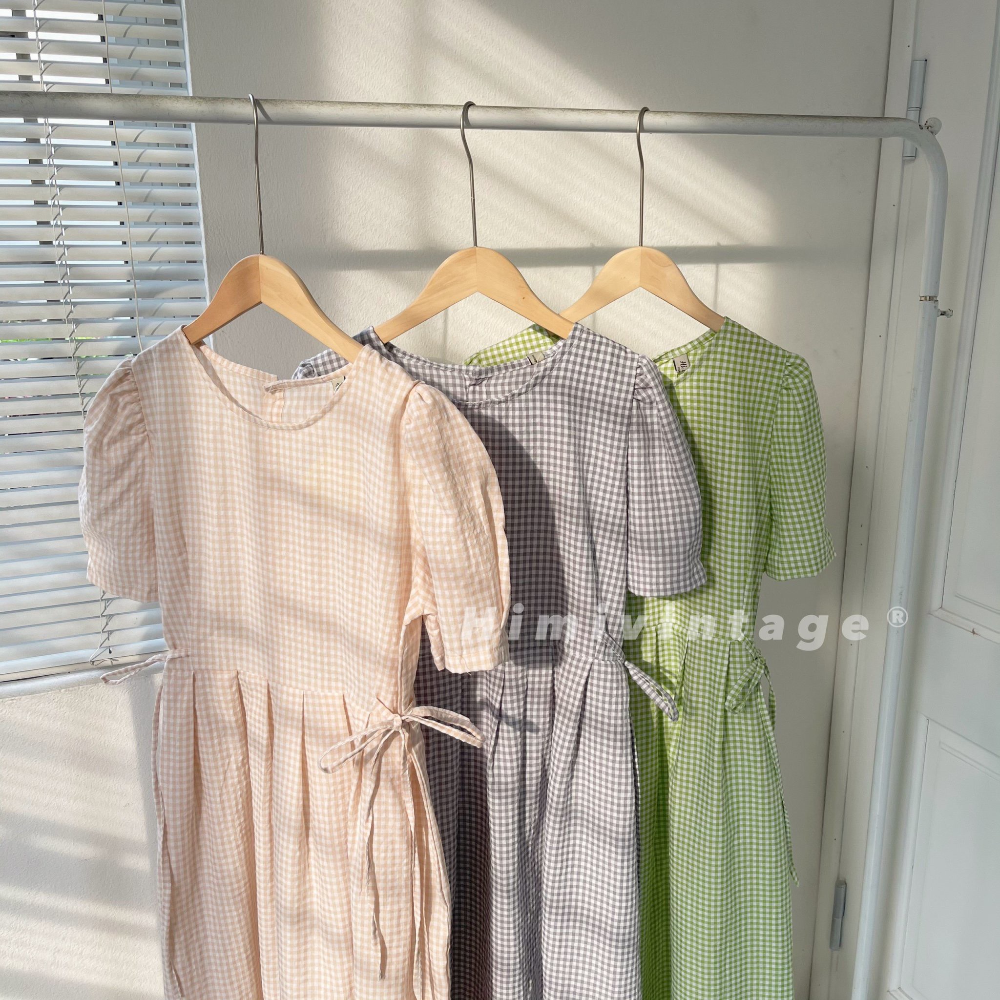 Đầm caro babydoll dây thắt nơ eo