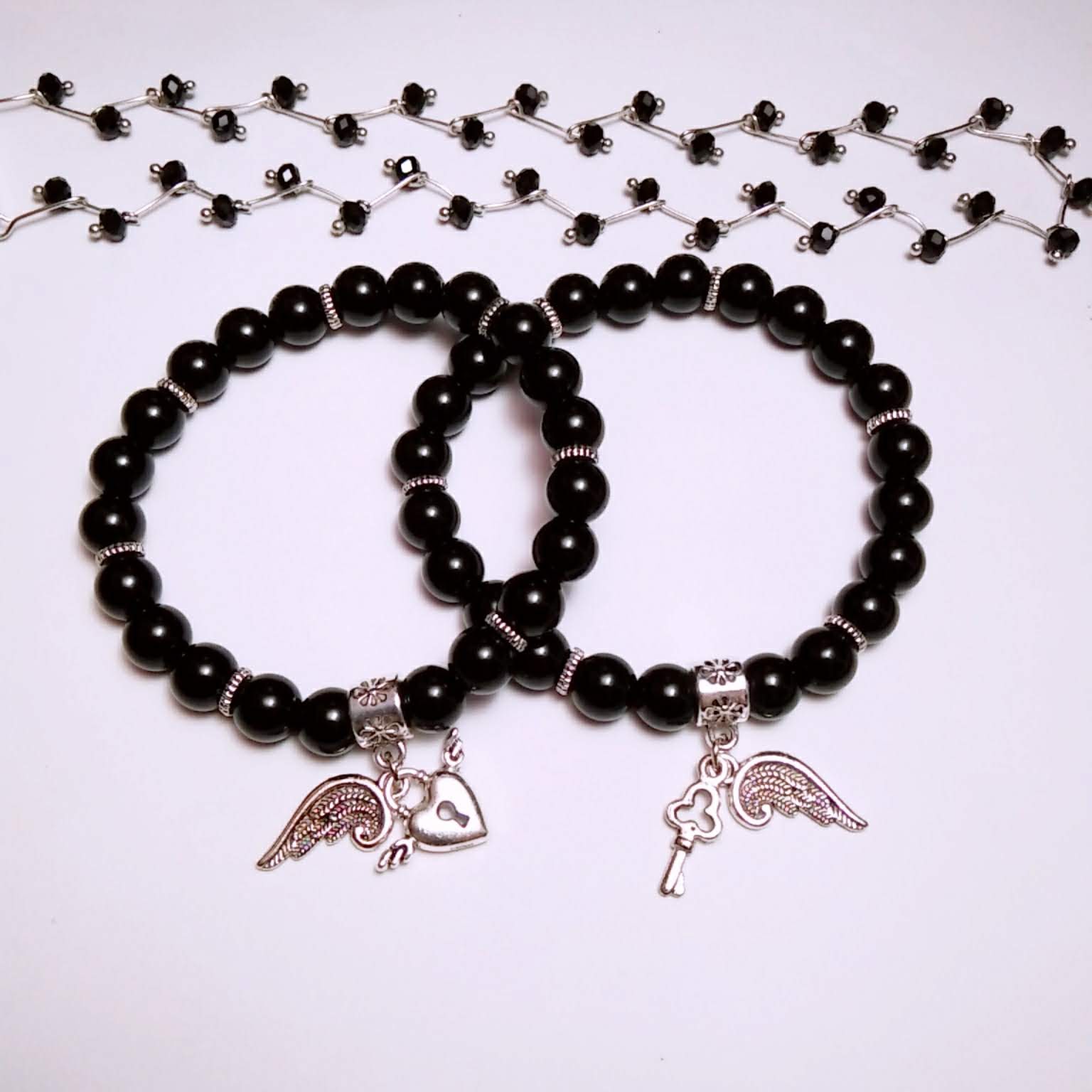 Vòng tay cặp đôi chuỗi hạt charm đôi cánh (2 vòng)