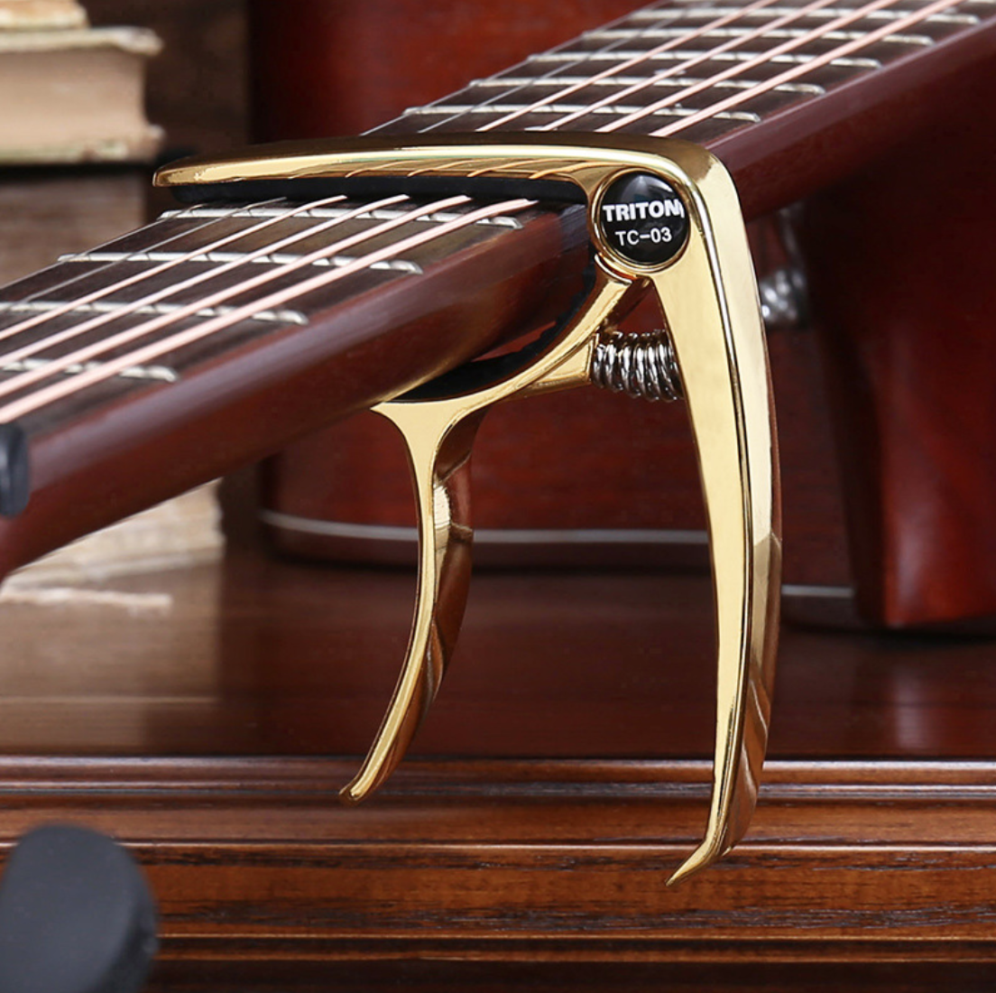 Capo Đàn Guitar/Ukulele Vân Gỗ TC-03.