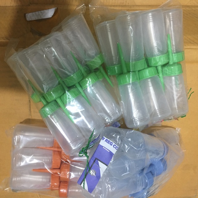 Dầu máy khâu ( 2 chai loại 0,5lít ) , kèm 1 vịt dầu bé
