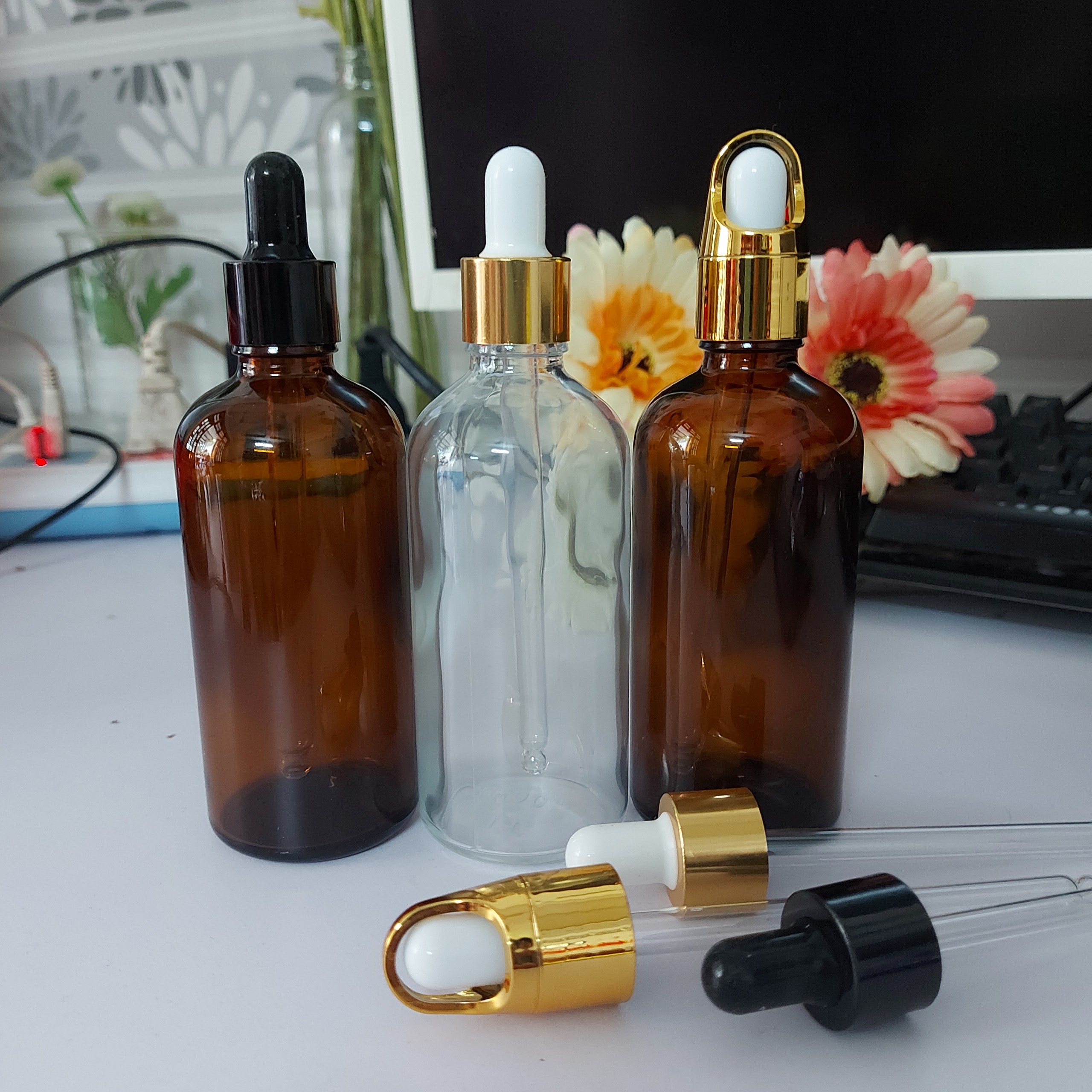 140 chai thủy tinh nắp bóp vàng, bóp đen, bóp quai 100ML chiết tinh dầu, đựng serum