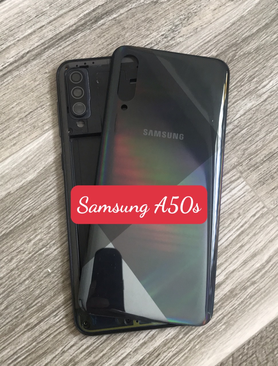 Bộ vỏ samsung A50s zin (bộ gồm lưng, sườn ,nút bấm, kính camera)