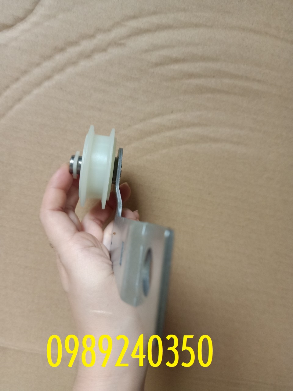 Bánh tỳ căng dây curoa máy sấy Whirlpool
