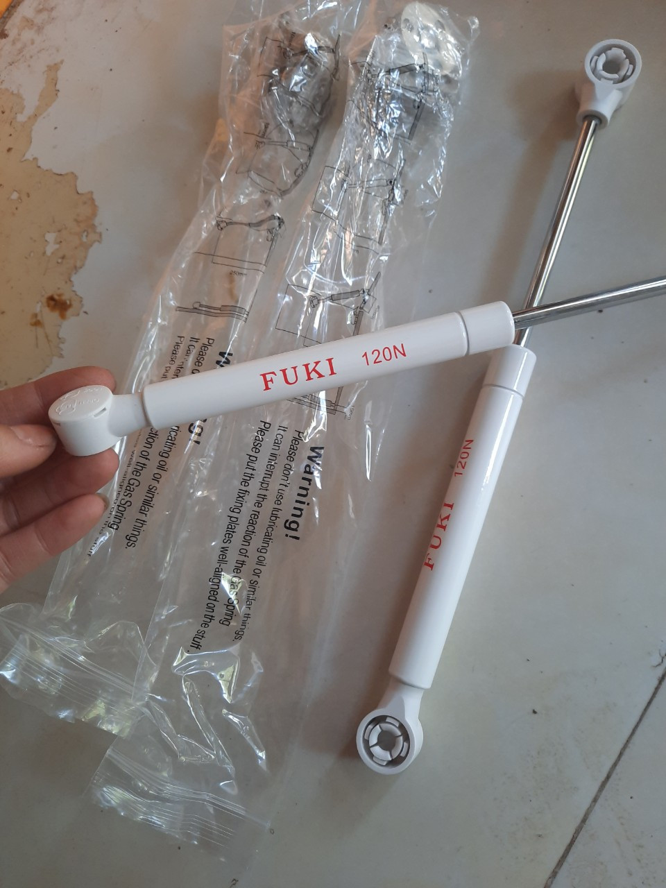 Piston nâng cánh tủ bếp
