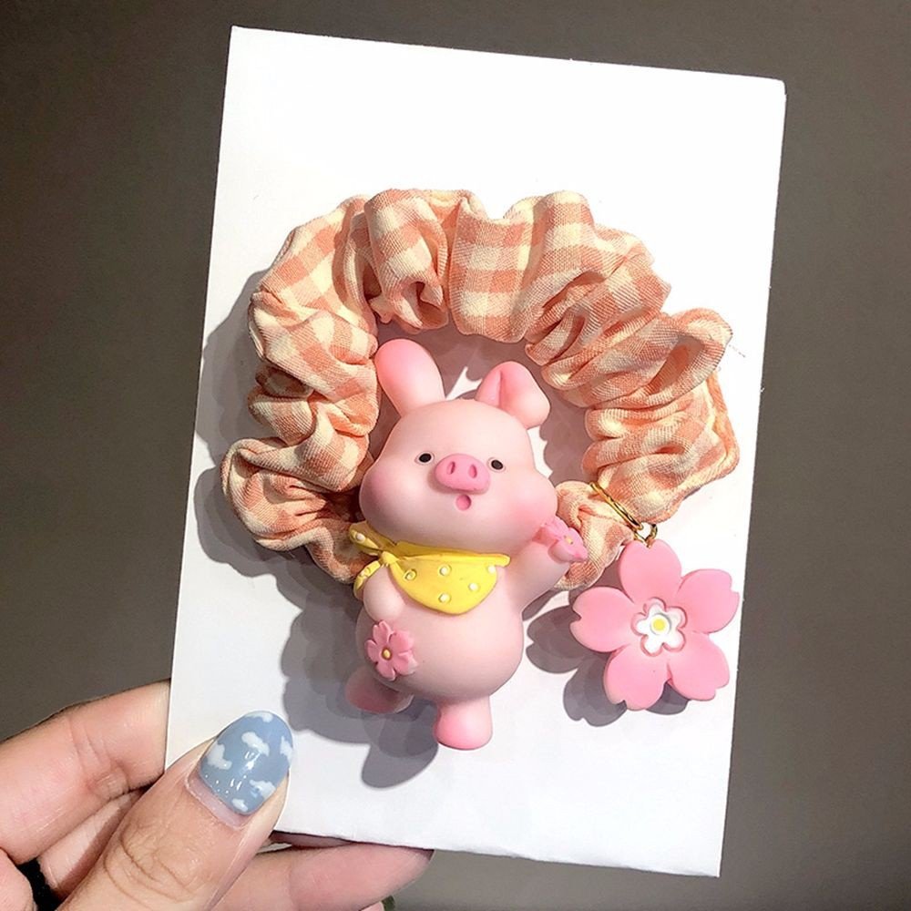 Cột tóc heo hồng tiểu thư