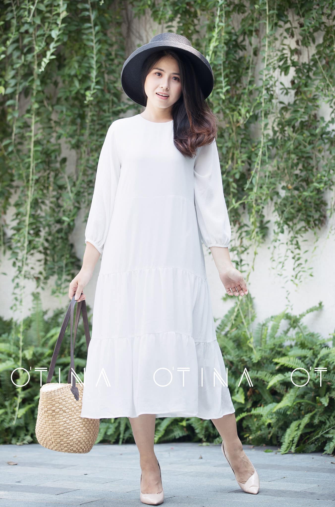 Đầm trắng tay dài babydoll