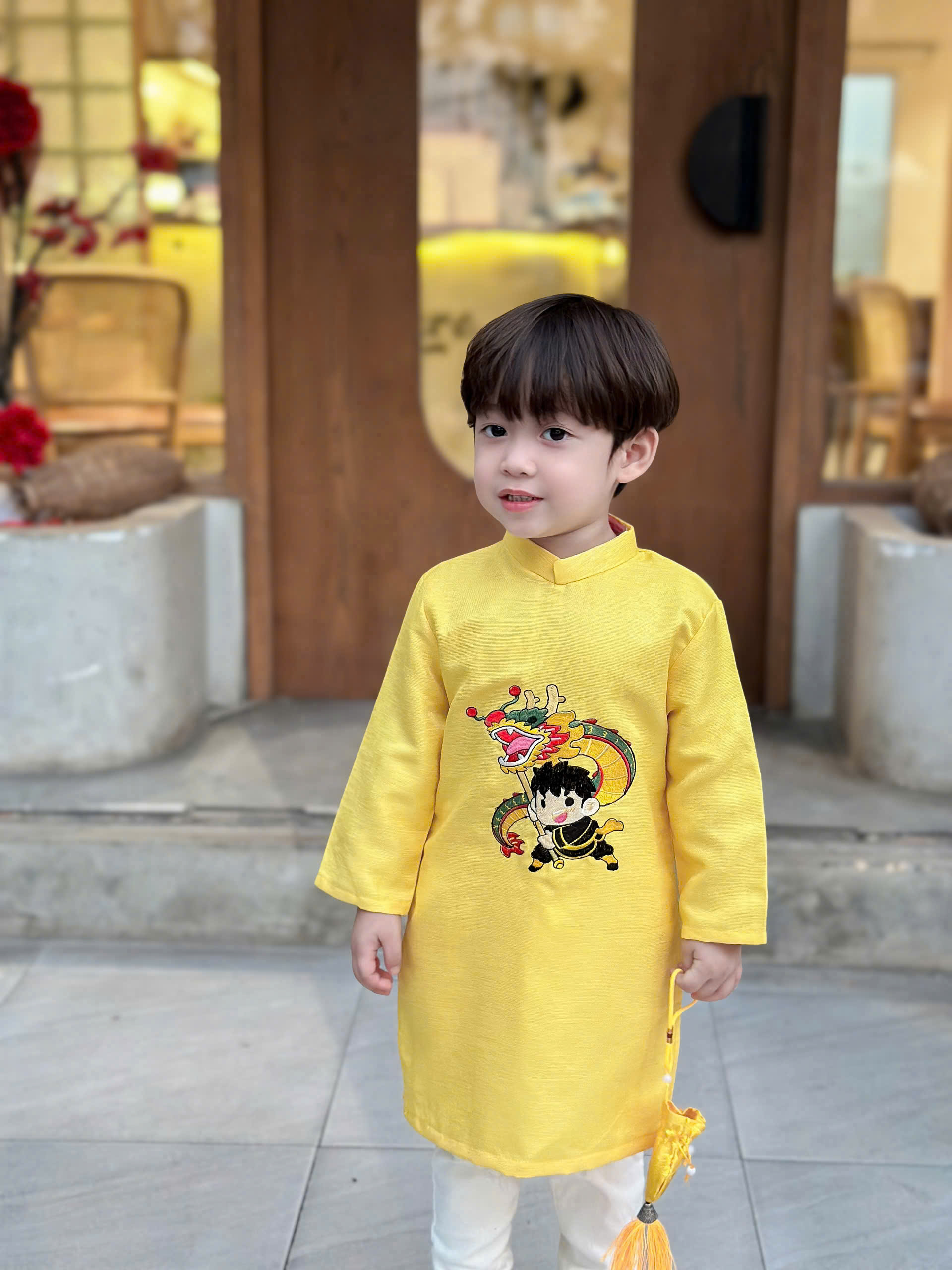 Áo dài cách tân thêu bé trai múa lân viền cổ nổi bật - Áo Dài Sài Gòn H&T