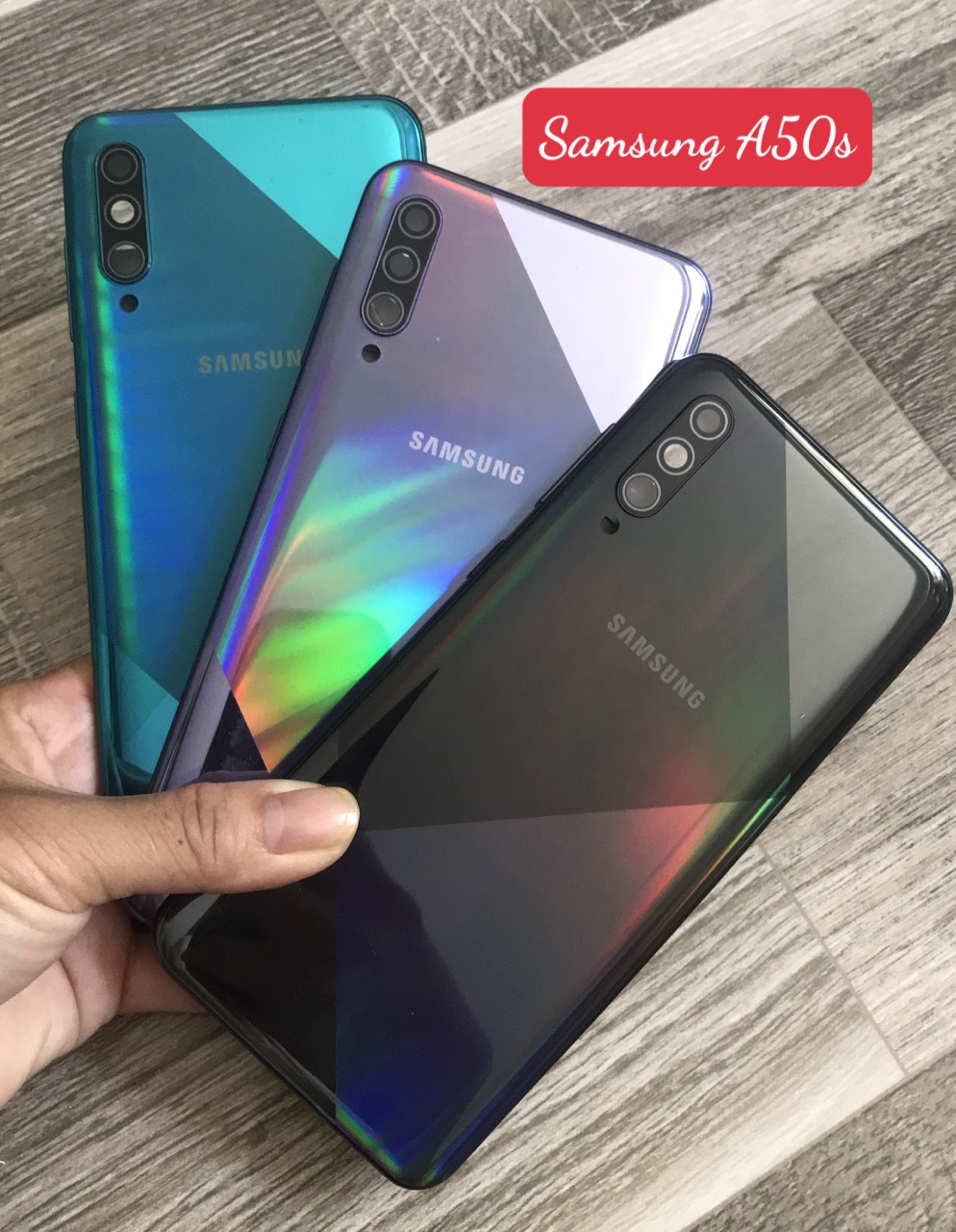 Bộ vỏ samsung A50s zin (bộ gồm lưng, sườn ,nút bấm, kính camera)