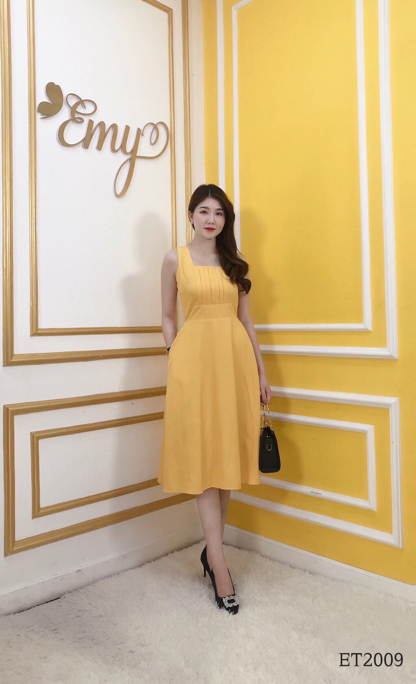 Đầm emy et2009 xoè vàng sát nách