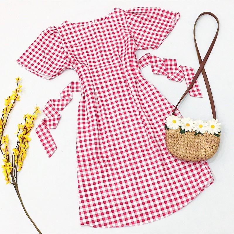Đầm caro đỏ to cột nơ sau