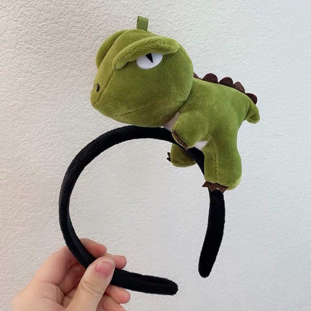 Carrot-annoying dinosaur hair band