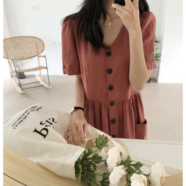 Đầm nút trước 2 túi