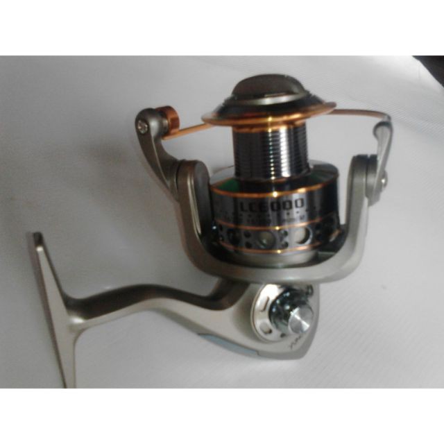 máy câu cá kim loại yumoshi lc7000  (cam kết bán hàng chất lượng có bảo hành)