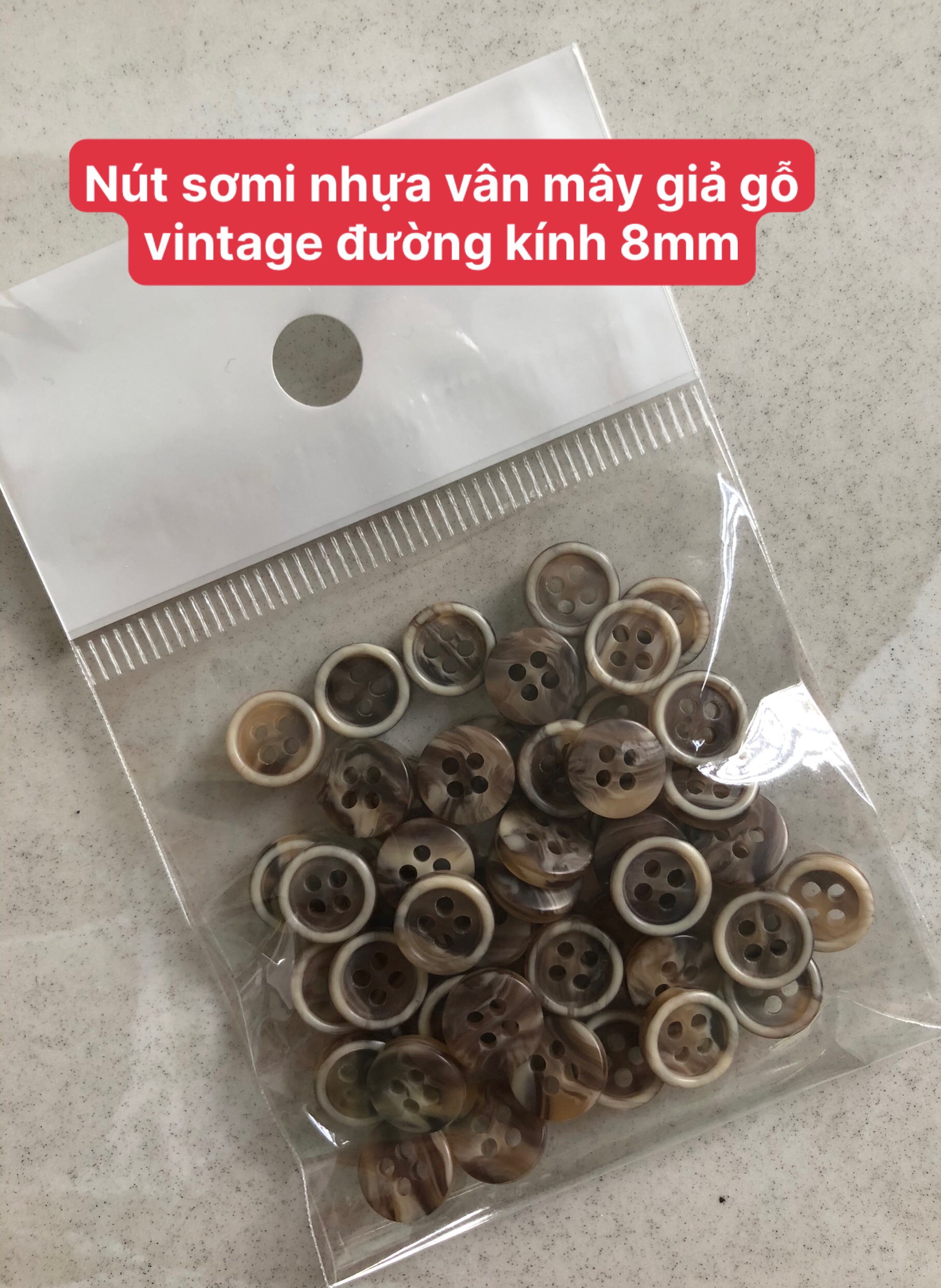 (50 nút) Nút nhựa vân mây 4 lỗ đường kính 8mm