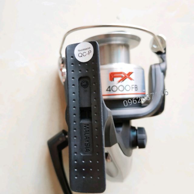 Máy câu cá shimano fx4000 loại 1 malaisia   ( xả kho )