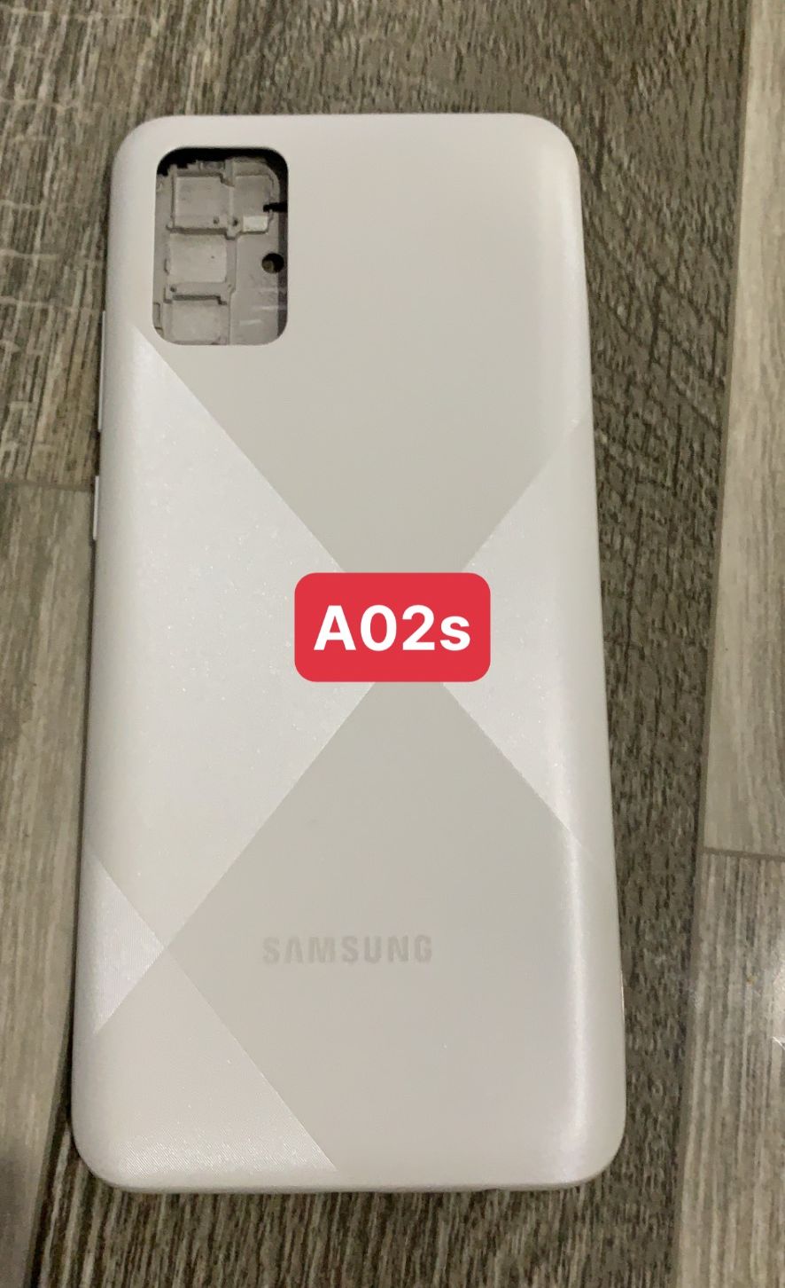 bộ vỏ samsung A02S ( gồm, sườn,lưng,maket, nút bấn)