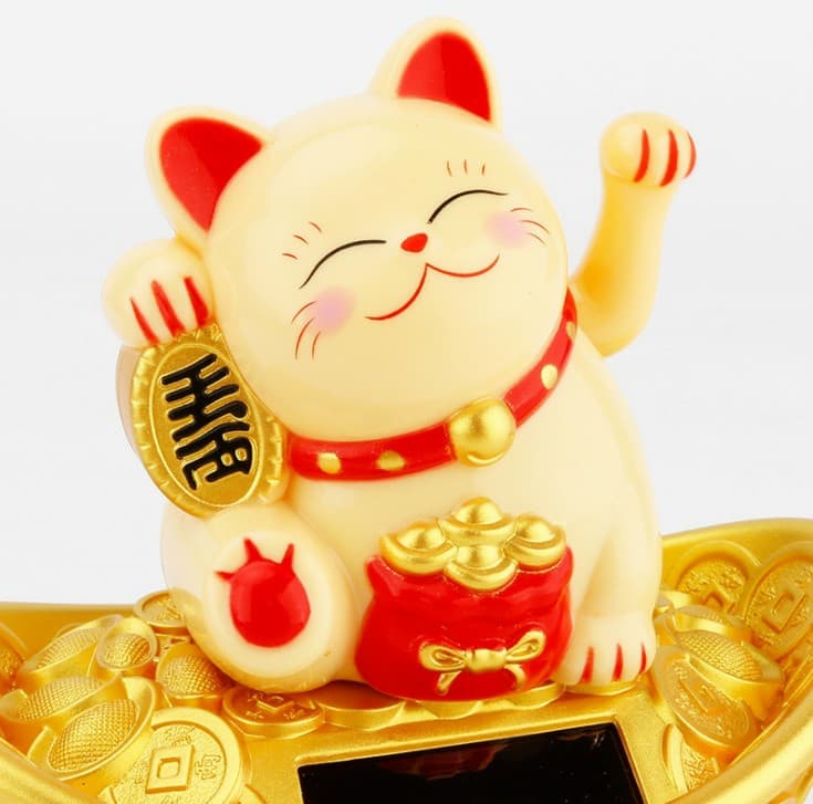 Mèo Ngoắc Ngồi Thỏi Vàng
