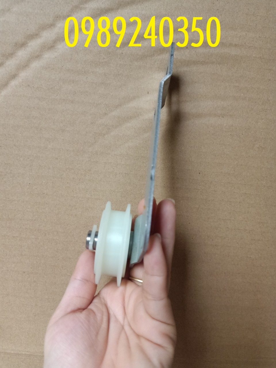 Bánh tỳ căng dây curoa máy sấy Whirlpool
