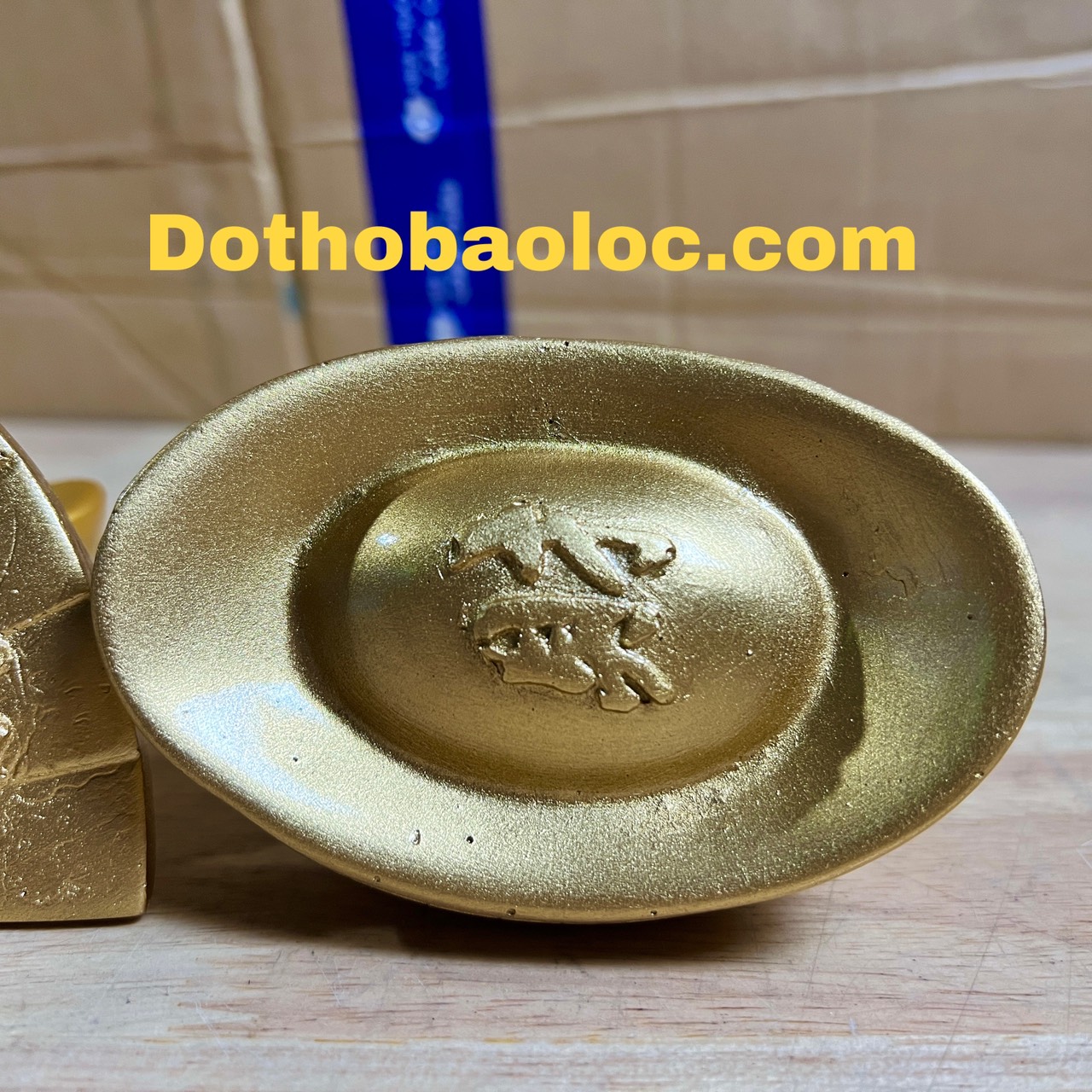 Thỏi vàng, quạt tượng di lặc bằng bột đá