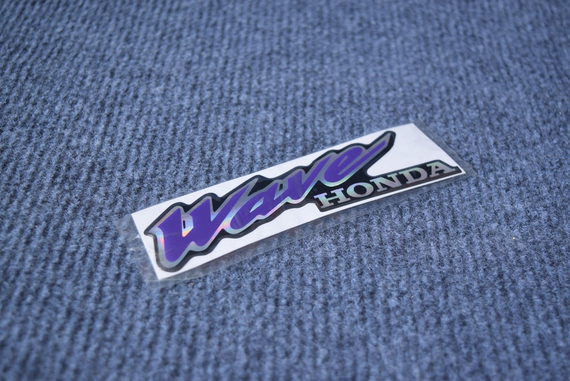 Tem logo nổi Wave dán trang trí.