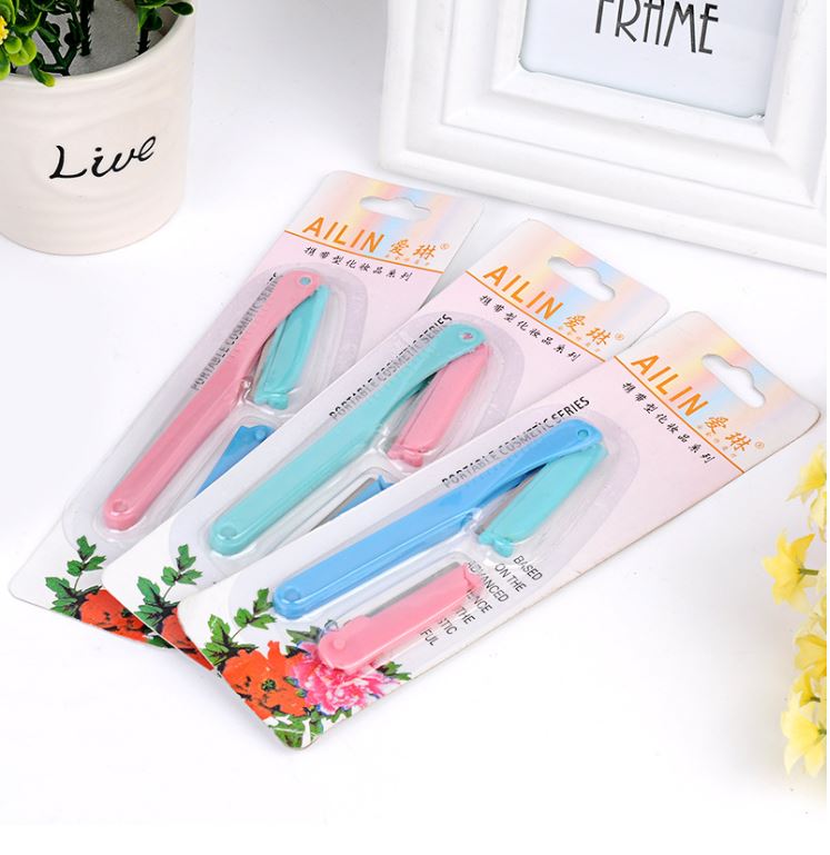Utility mini eyebrow trimmer with replacement blades