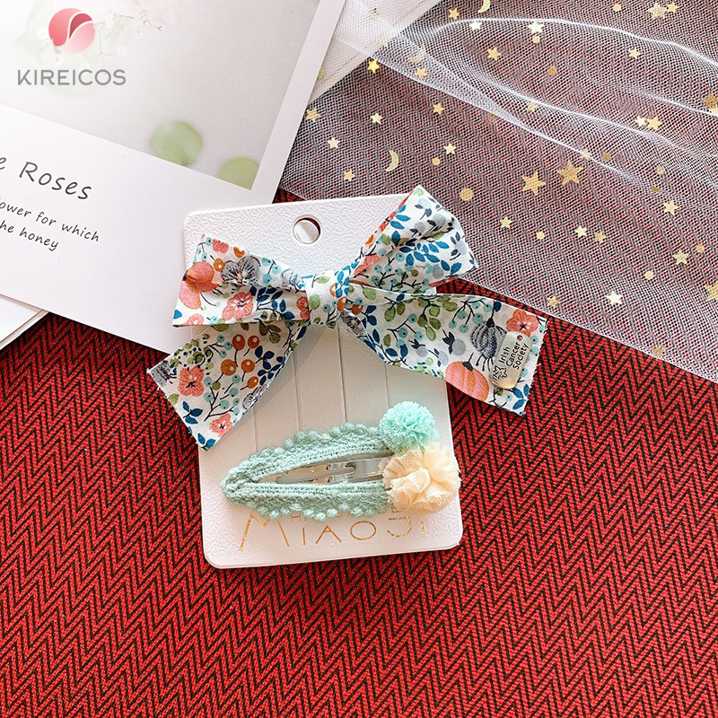 Set 2 kẹp tóc nơ hoa nhí và kẹp bấm mái quả cầu lưới - kireicos