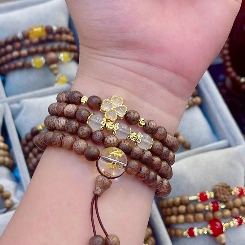 Vòng tay 108 hạt Trầm Tốc mix charm cỏ 4 lá may mắn