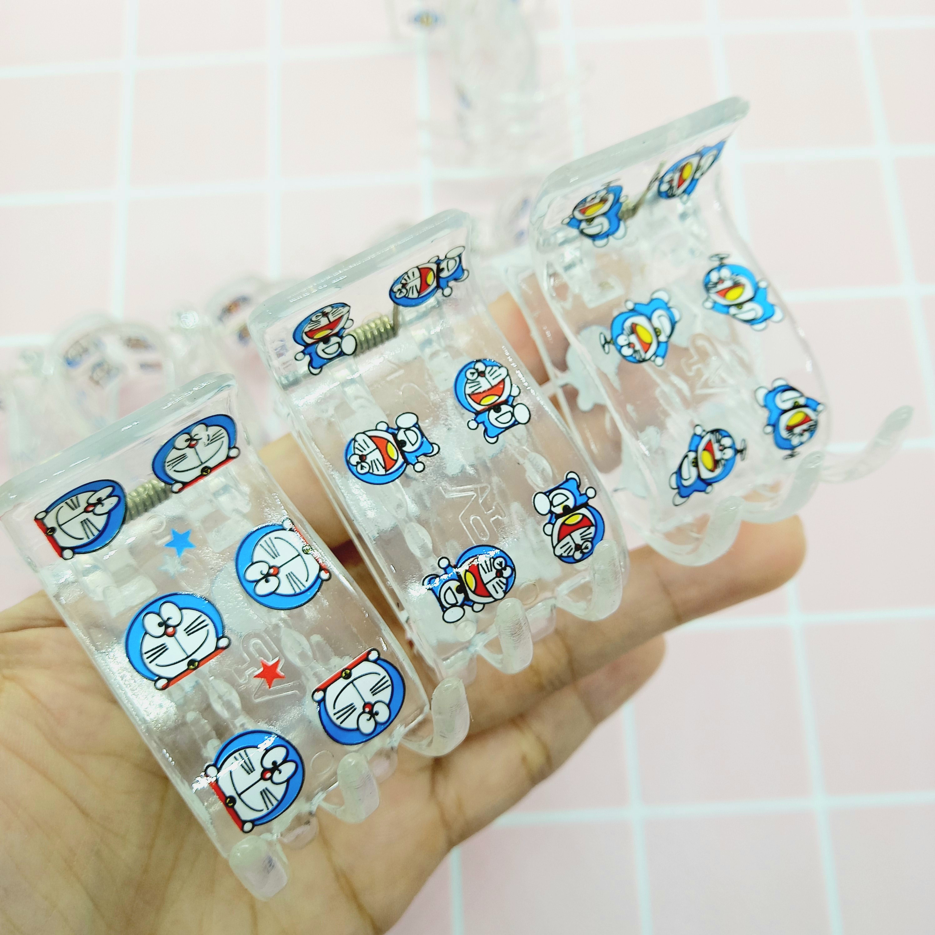 Kẹp tóc càng cua 5 răng trong trắng Đôrêmon nhí