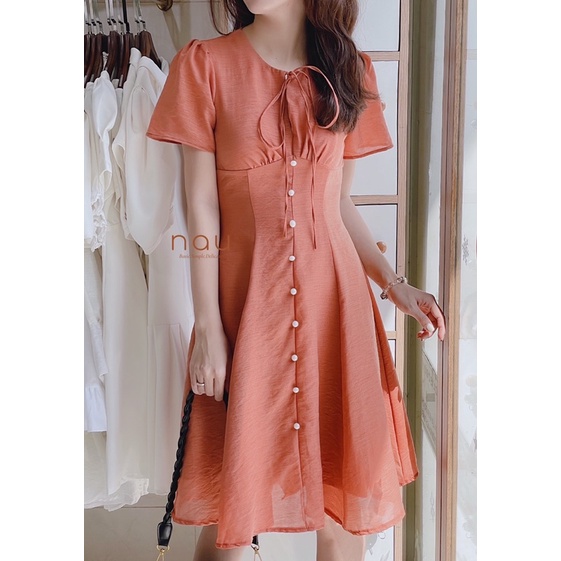 Đầm phối nút ngọc dáng xoè nhẹ cột nơ cổ