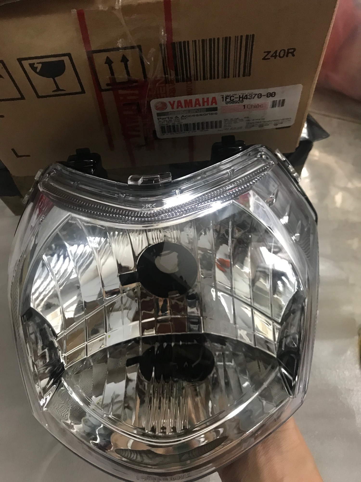 Pha đèn trước ( choá đèn) xe Sirius Fi hãng Yamaha