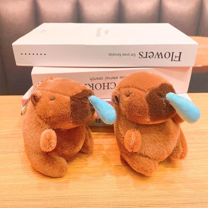 Móc khóa capybara chảy mũi rút mũi hot trend