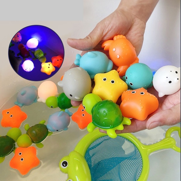 Đồ chơi nhà tắm trọn bộ gồm vợt ếch + 4 thú bơi dưới nước phát sáng vừa tay cho bé