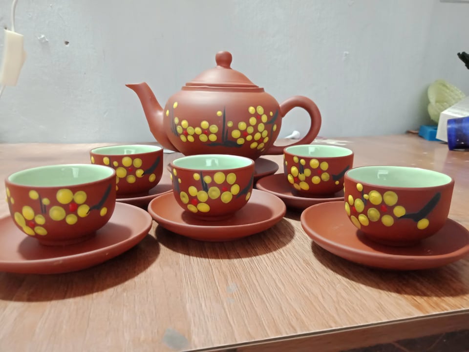 Bộ ấm chén trà Bát Tràng hoa đào vàng