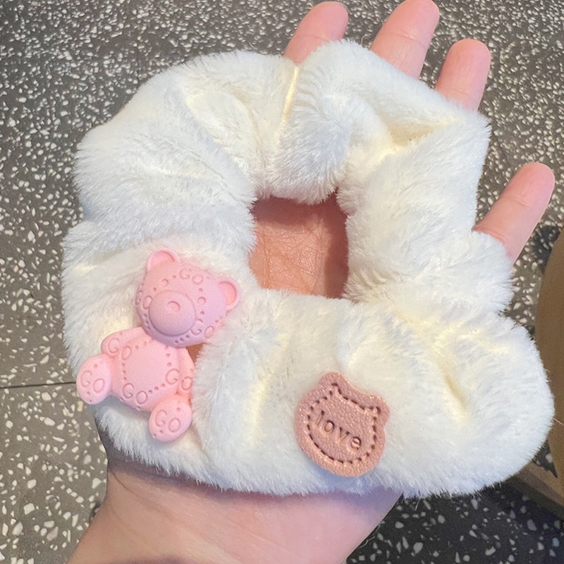 Cột tóc lông gấu hồng cute
