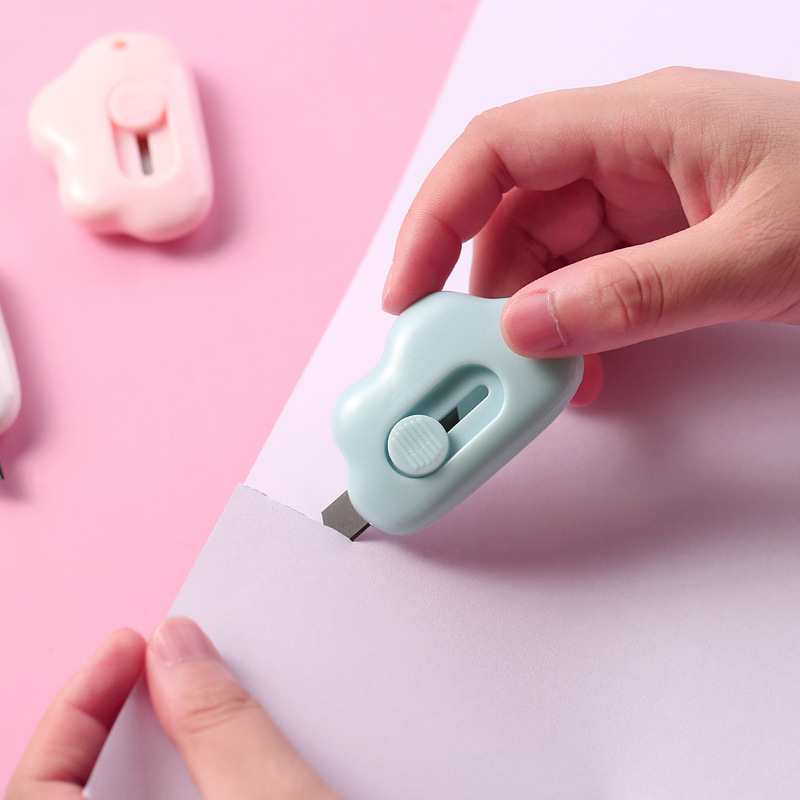Cute and compact cloud-shaped paper cutter with self-retracting blade, safe and convenient
