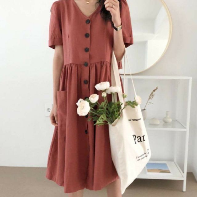 Đầm nút trước 2 túi