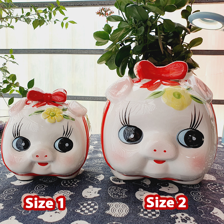 Lợn đất tiết kiệm mẫu heo nơ hoa nổi gốm sứ gồm 4 kích thước size 1, size 2, size 3, size 4 từ nhỏ đến to ống heo đựng tiền