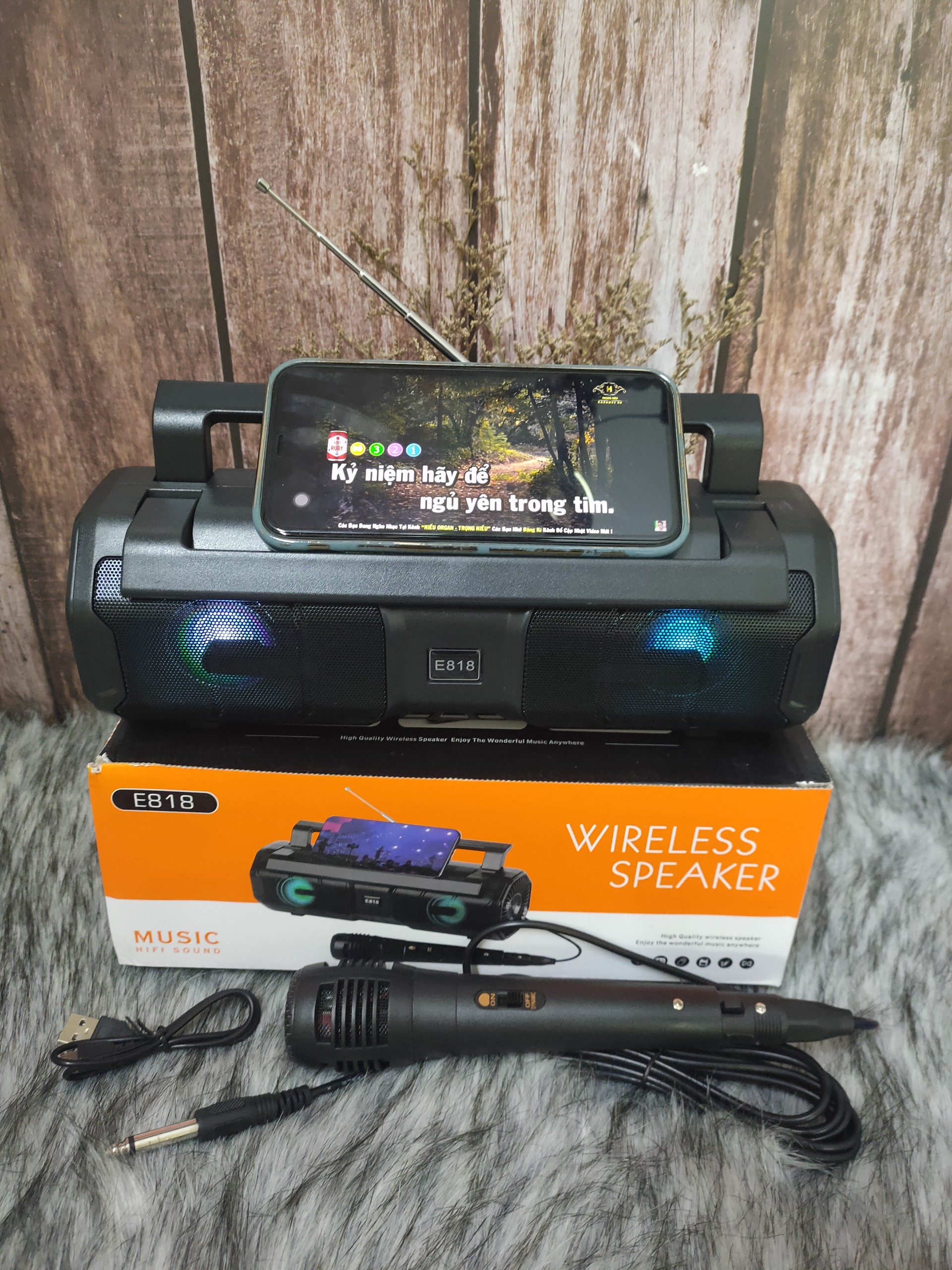 Km-s1 e818 Bluetooth karaoke speaker direct plug wired microphone karaoke speaker LED lamp strobe strong bass battery nice design 5D surround sound