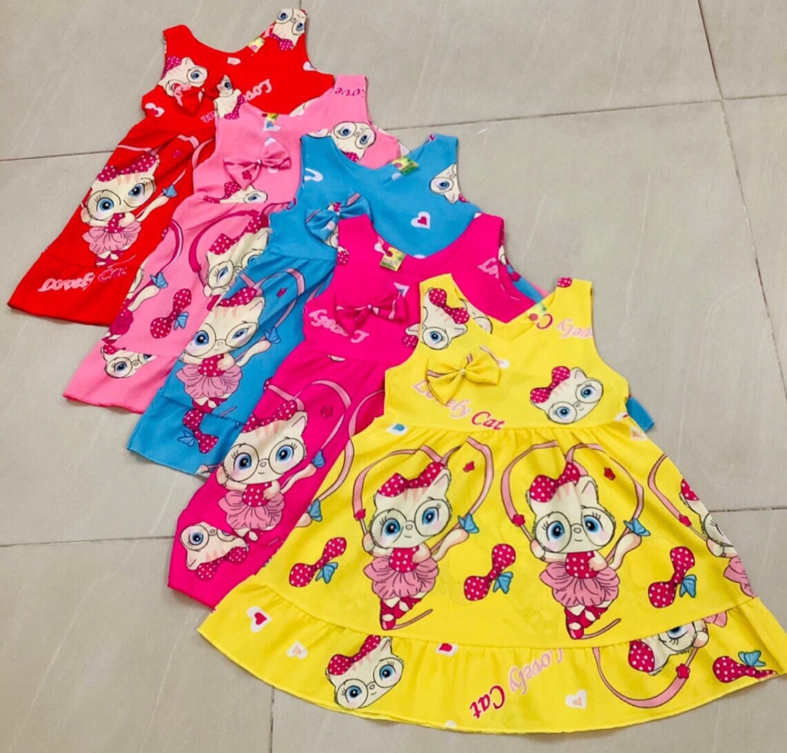 Đầm Lụa Sát Nách Họa Tiết Dễ Thương Bé (8-16kg) (giao màu ngẫu nhiên)