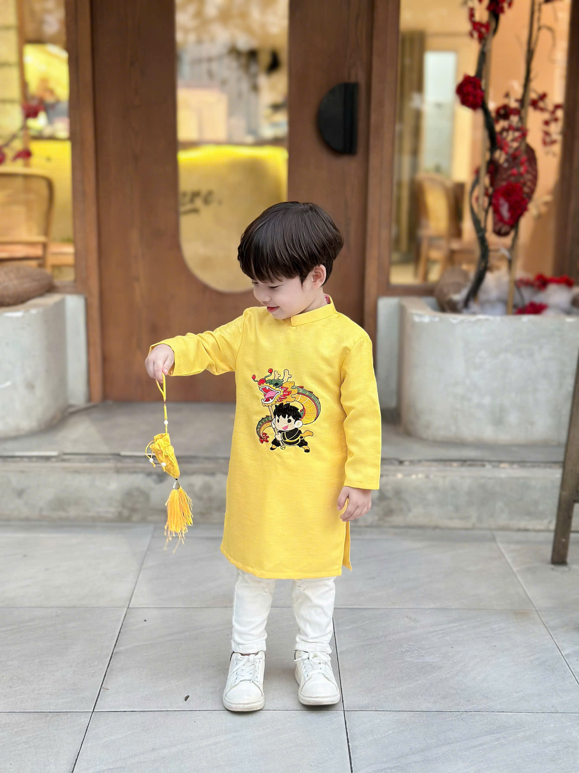 Áo dài cách tân thêu bé trai múa lân viền cổ nổi bật - Áo Dài Sài Gòn H&T