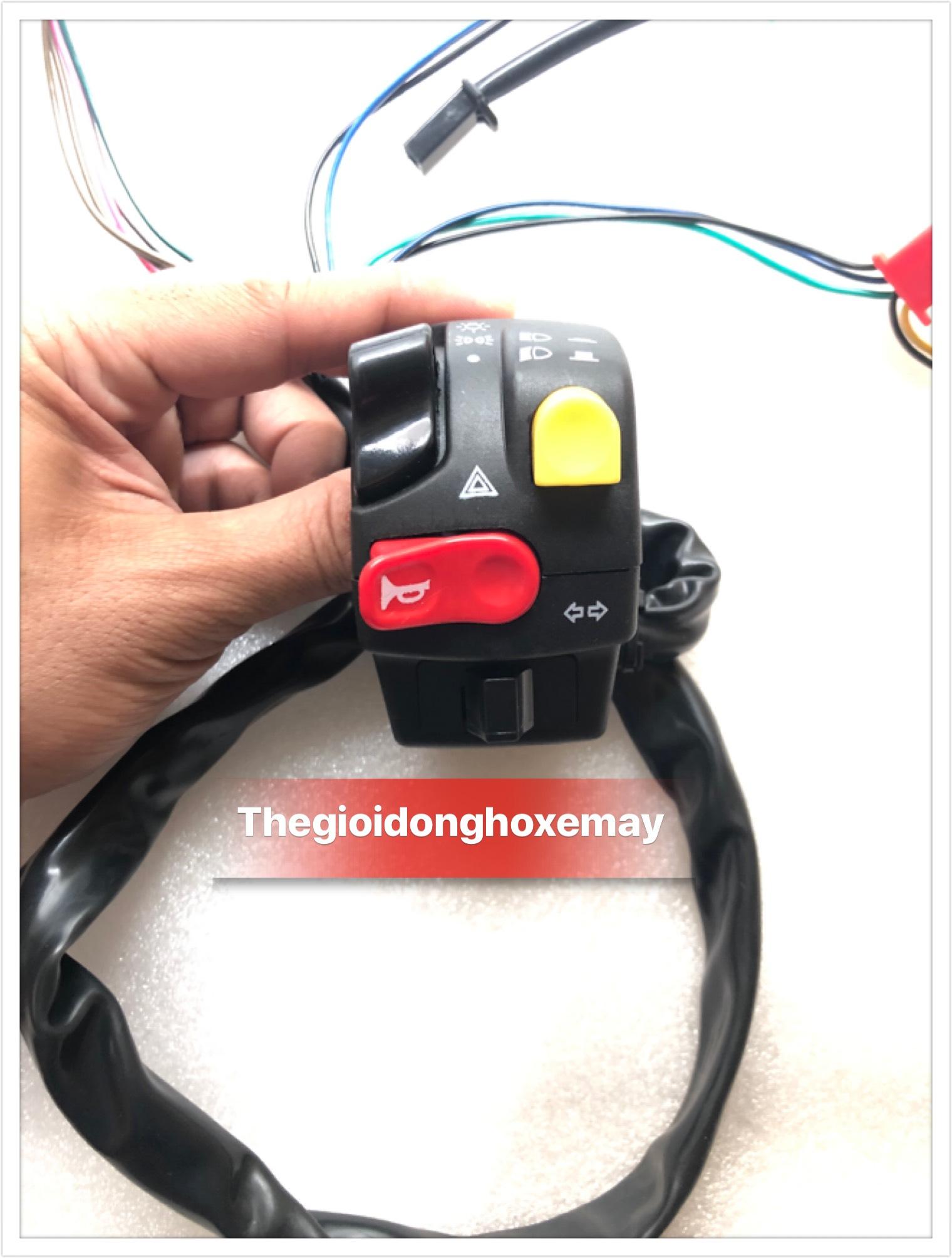 cùm công tắc domino nút vàng bên trái