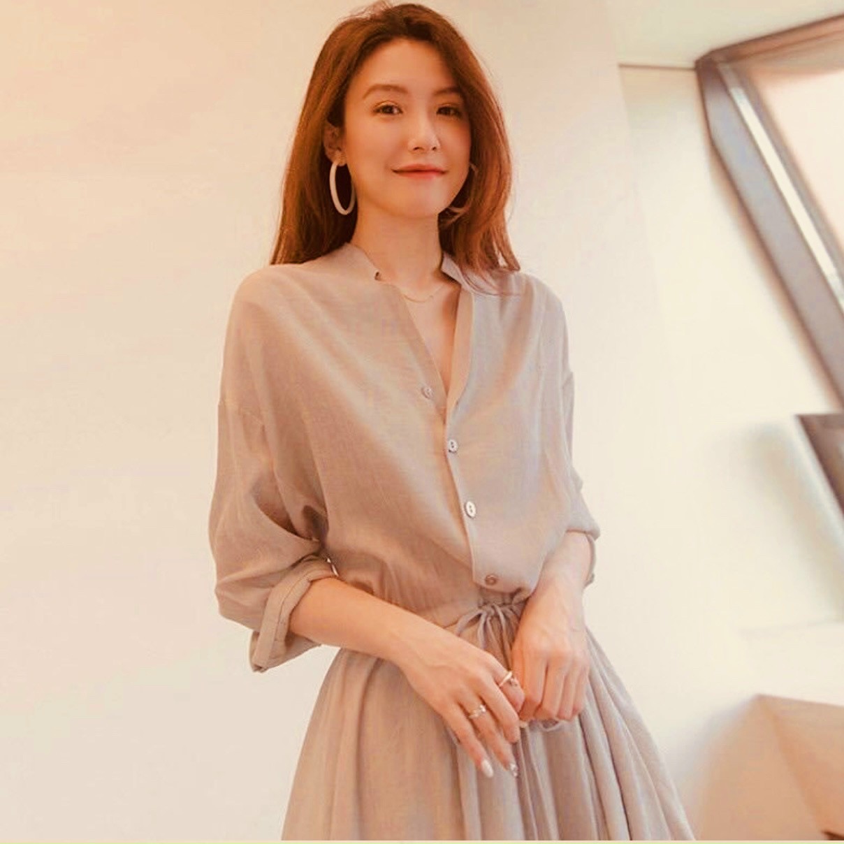 Đầm kem cổ trụ rút eo