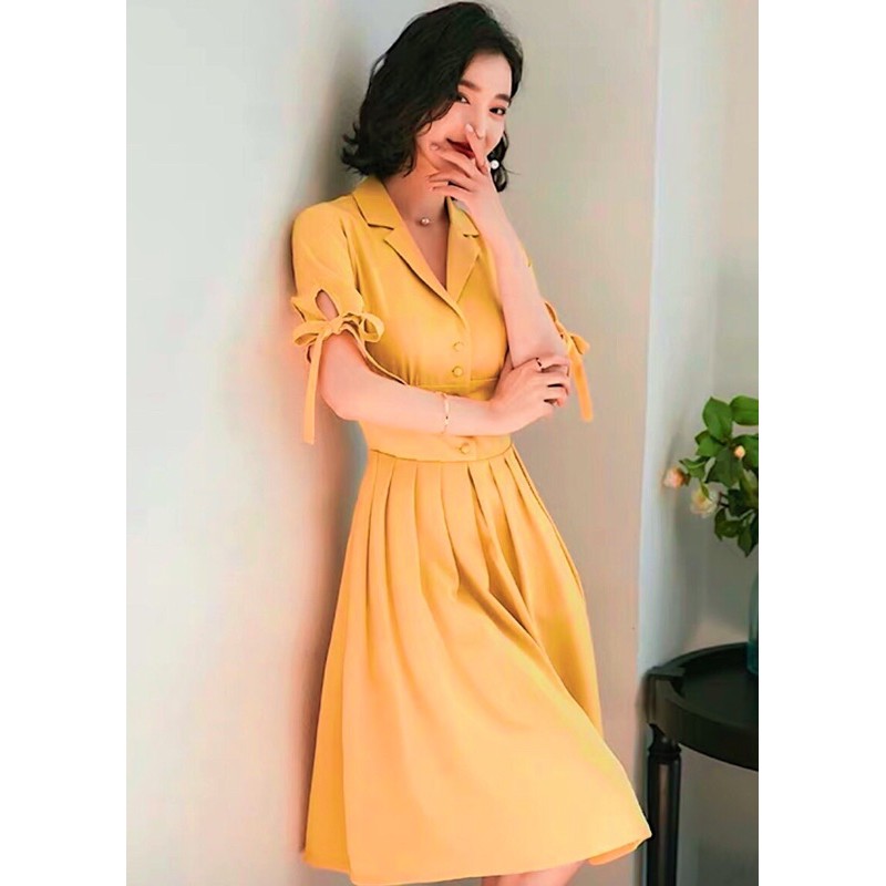 Đầm sm vàng nghệ nút bọc