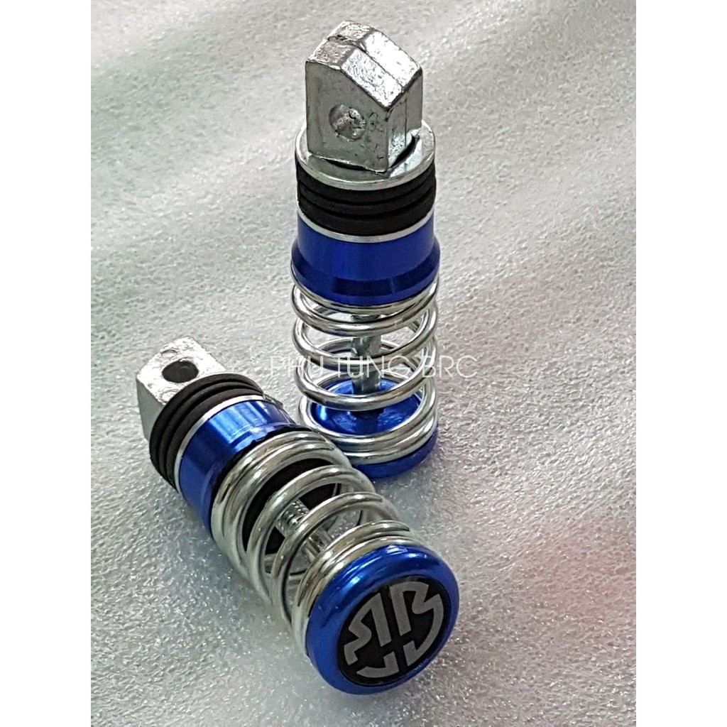 Gác chân sau lò xo xe máy ( 1 đôi, tặng 2 con ốc kiểu để lắp).