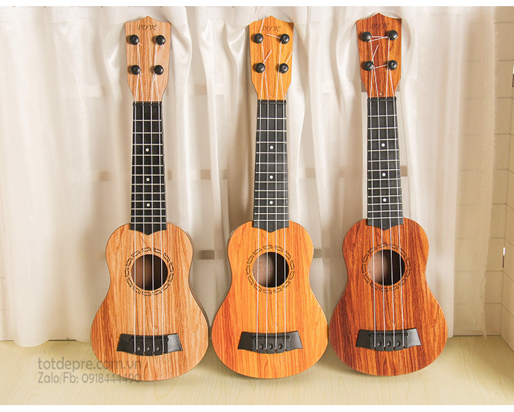 [HCM]Đồ chơi đàn guitar mini 4 day vân gỗ cho trẻ tập chơi đàn