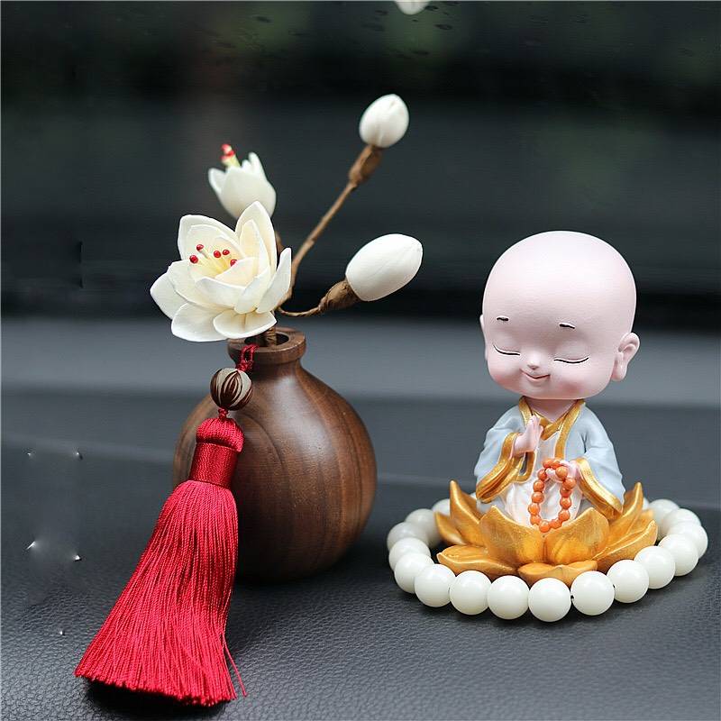Tượng chú tiểu tọa sen thiền định đầu lắc lư