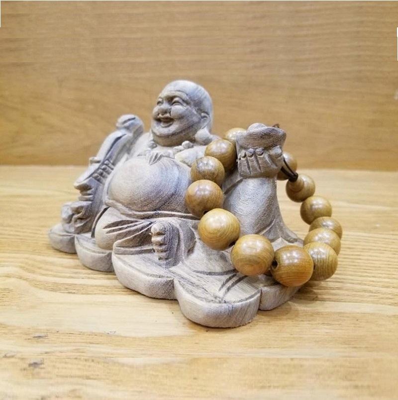 Tượng phật di lặc để ô tô gỗ xá xị
