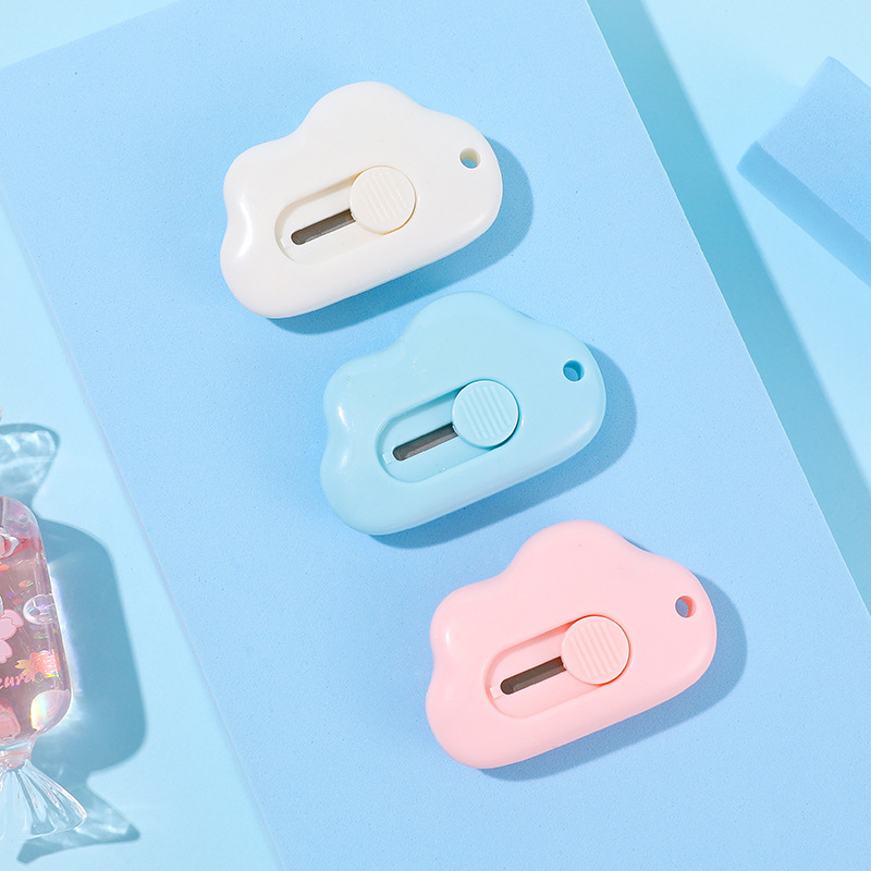 Cute and compact cloud-shaped paper cutter with self-retracting blade, safe and convenient