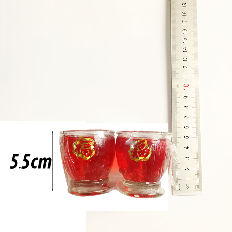 Pair of small and medium-sized glass candles used for worship and lighting
